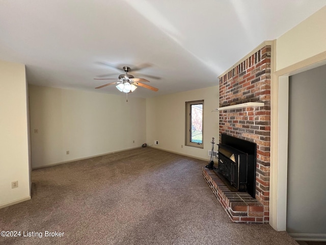 unfurnished living room with a brick fireplace, ceiling fan, and carpet floors