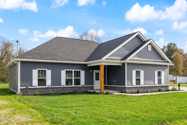 craftsman-style home with a front lawn