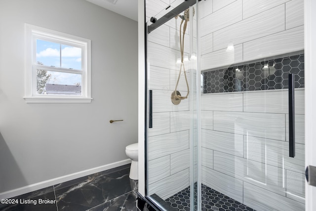 bathroom with toilet and an enclosed shower