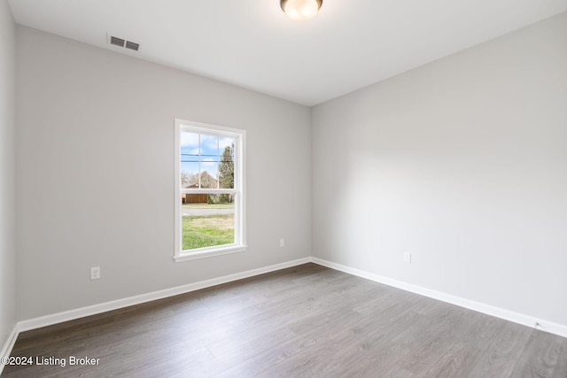 empty room featuring hardwood / wood-style flooring