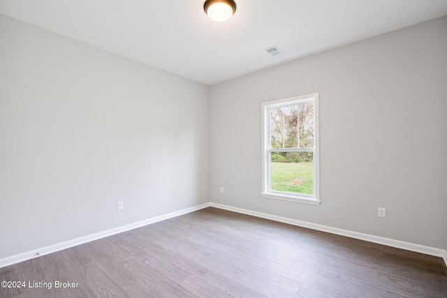 unfurnished room featuring hardwood / wood-style flooring