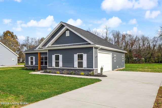 view of front of house with a garage and a front yard