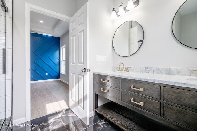 bathroom with hardwood / wood-style flooring and vanity