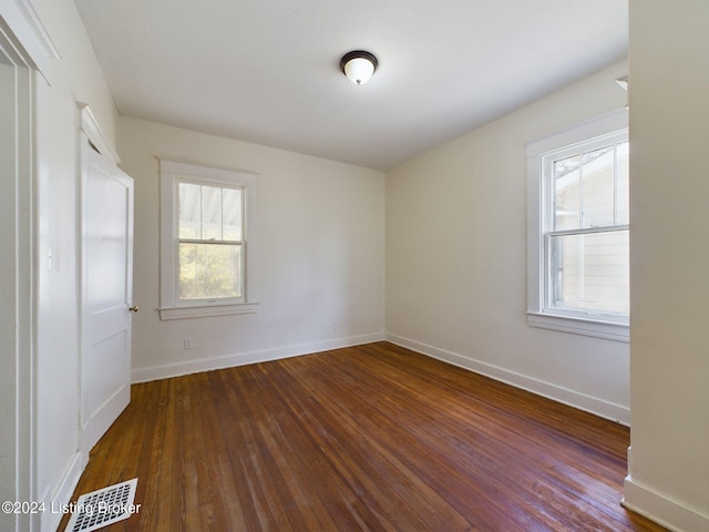 spare room featuring hardwood / wood-style floors