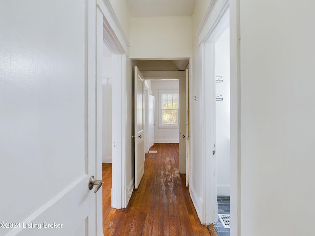 hall with dark wood-type flooring