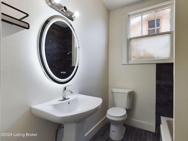 full bathroom with tile patterned flooring, toilet, plus walk in shower, and sink