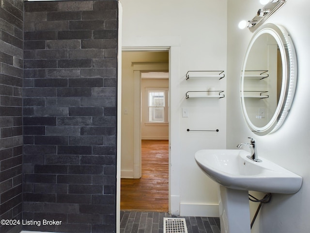 bathroom with hardwood / wood-style flooring