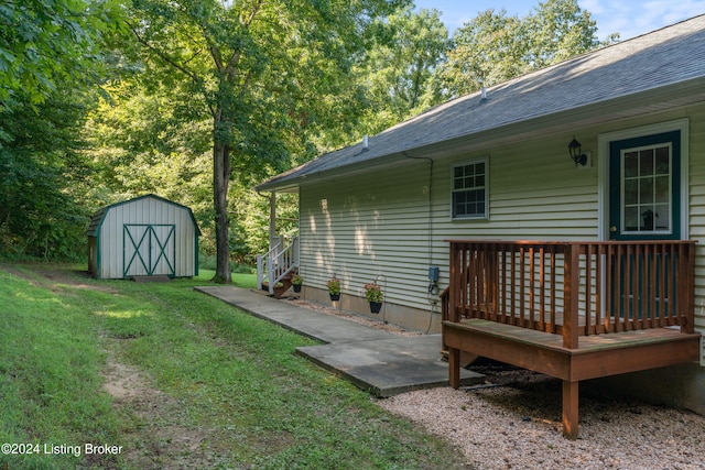 view of yard with a shed and a deck