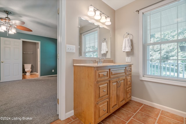 bathroom featuring vanity, ceiling fan, and tile patterned floors