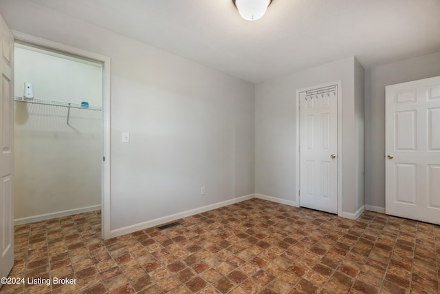 unfurnished bedroom featuring a closet