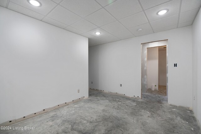 empty room with a drop ceiling