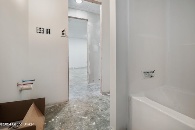 bathroom featuring a washtub