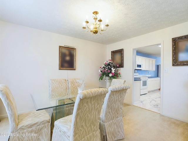 carpeted dining space with a chandelier and a textured ceiling