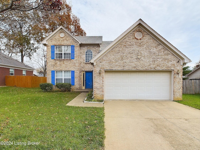 view of front property with a front yard and a garage