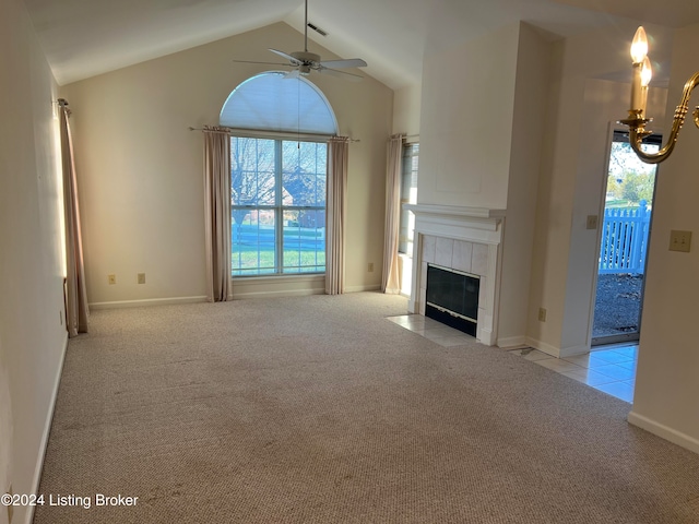 unfurnished living room featuring lofted ceiling with beams, light colored carpet, ceiling fan, and a fireplace