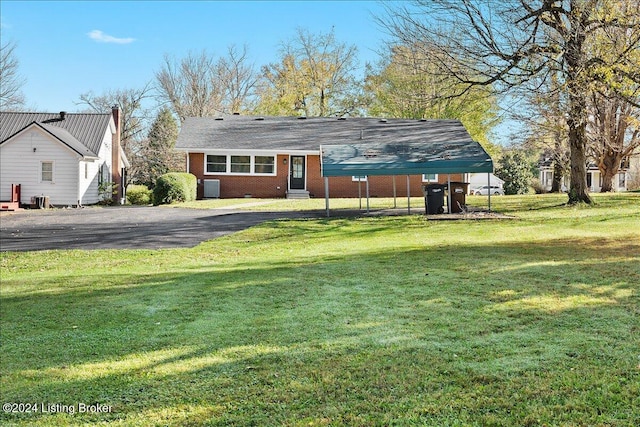 rear view of house with a yard