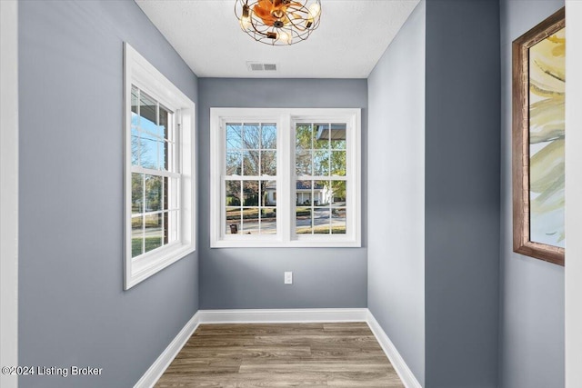 314 S Lincoln Blvd, Hodgenville, KY 42748 - unfurnished room featuring wood finished floors, healthy amount of natural light, and baseboards