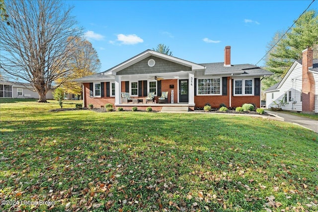 314 S Lincoln Blvd, Hodgenville, KY 42748 - ranch-style house featuring ceiling fan, brick siding, a front lawn, and a porch