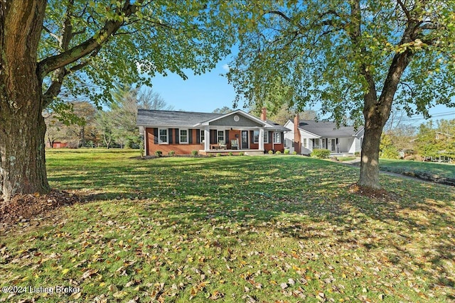 314 S Lincoln Blvd, Hodgenville, KY 42748 - ranch-style house with a front yard, covered porch, and a chimney