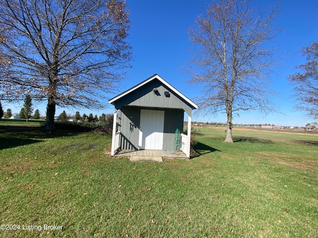 view of outbuilding featuring a lawn