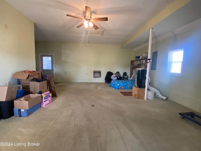 basement featuring heating unit and carpet floors