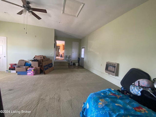 carpeted living room featuring heating unit, lofted ceiling, and ceiling fan