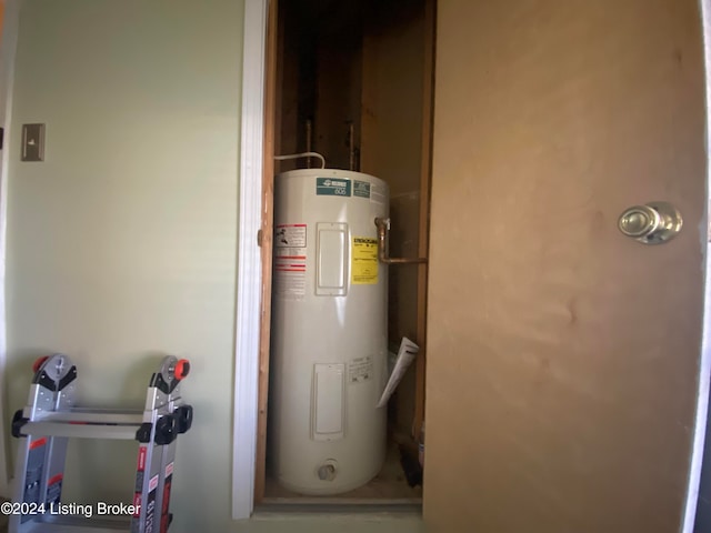 utility room featuring electric water heater