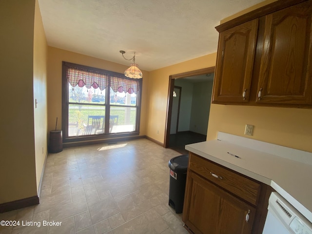 kitchen with dishwasher and pendant lighting