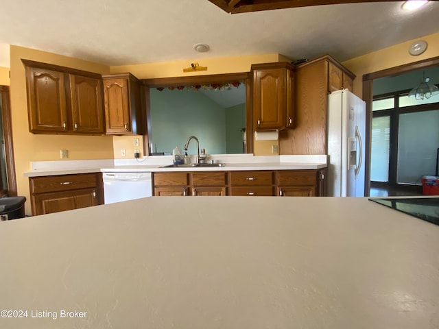 kitchen with sink and white appliances