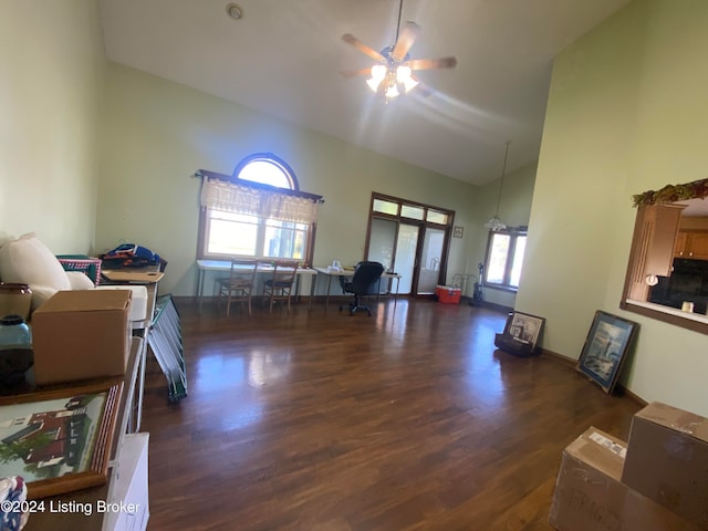 interior space featuring ceiling fan, high vaulted ceiling, and dark hardwood / wood-style flooring