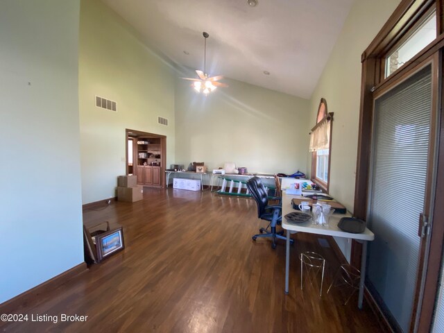 office featuring dark wood-type flooring and high vaulted ceiling