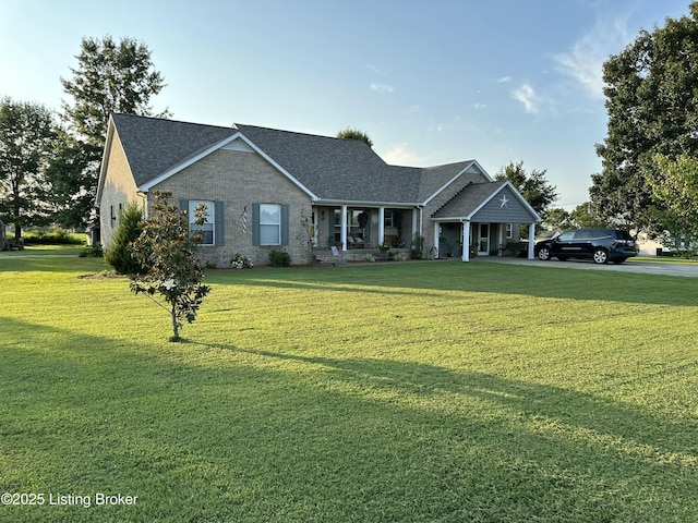 view of front of home featuring a front yard and covered porch