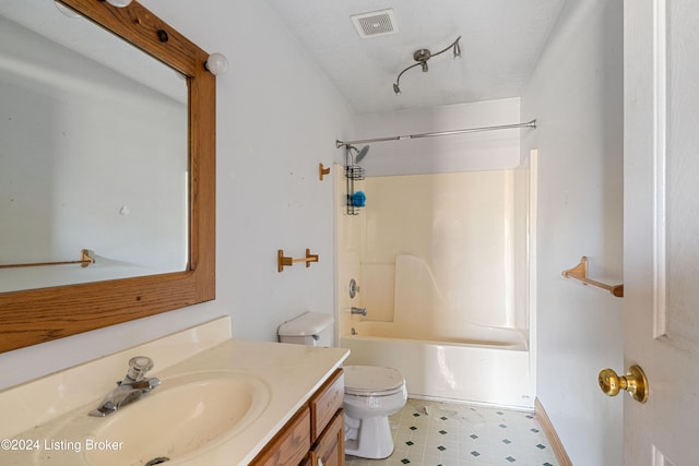 full bathroom with toilet, vanity, a textured ceiling, and shower / washtub combination