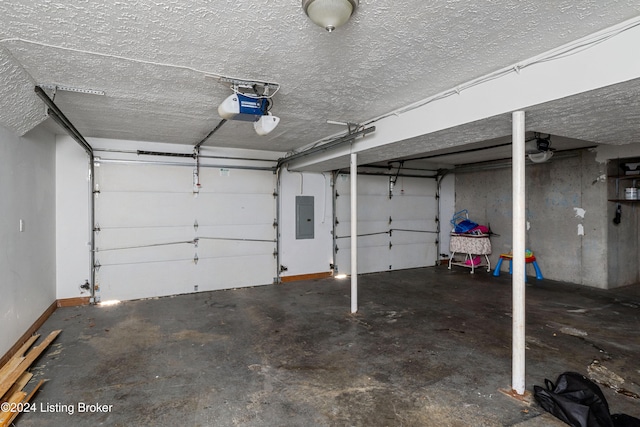 garage with electric panel and a garage door opener