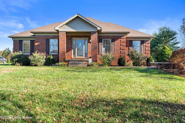 view of front of property with a front lawn