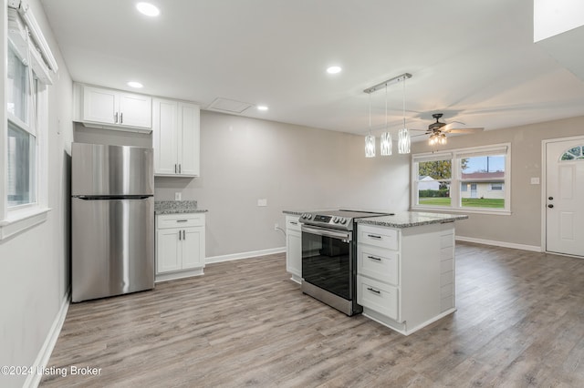 kitchen featuring appliances with stainless steel finishes, light stone counters, ceiling fan, light hardwood / wood-style floors, and white cabinetry