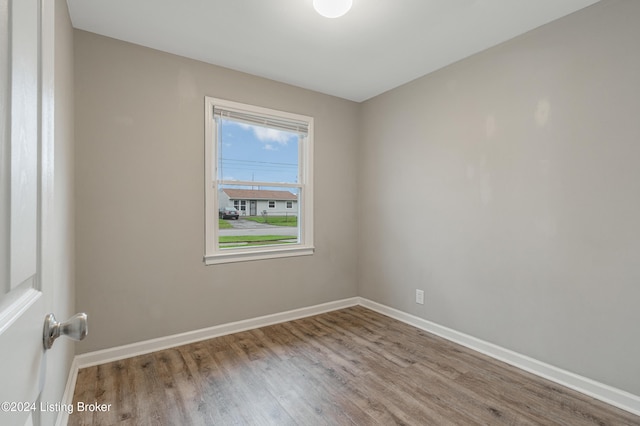 unfurnished room with light wood-type flooring