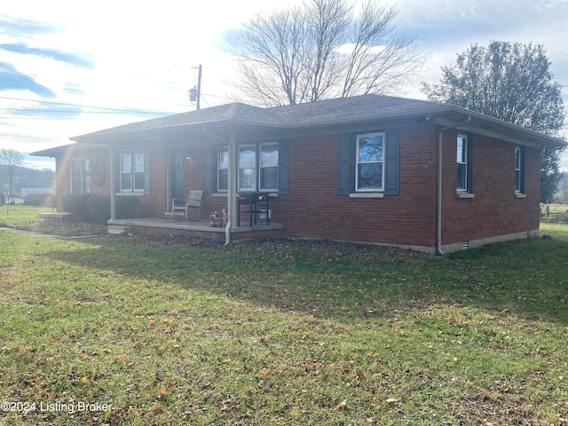 ranch-style home with a front lawn