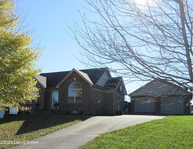 view of front of home featuring a front lawn and a garage