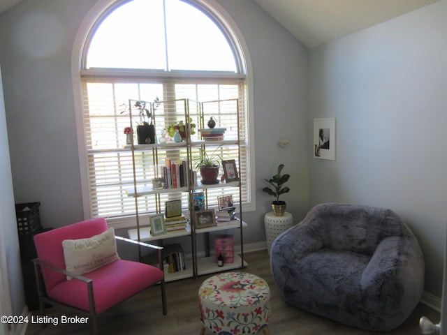 sitting room featuring hardwood / wood-style floors and vaulted ceiling