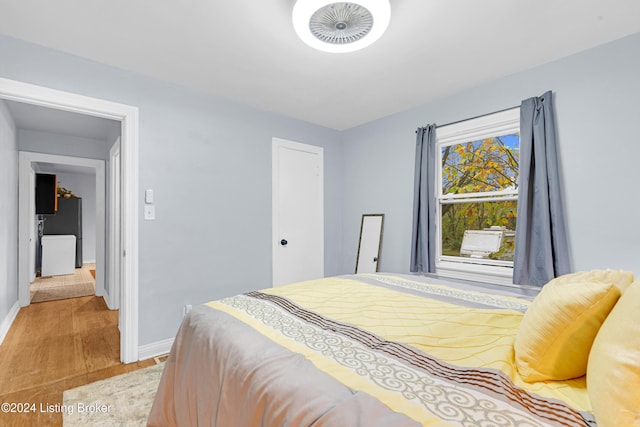 bedroom with light hardwood / wood-style flooring