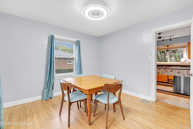 dining room with light wood-type flooring