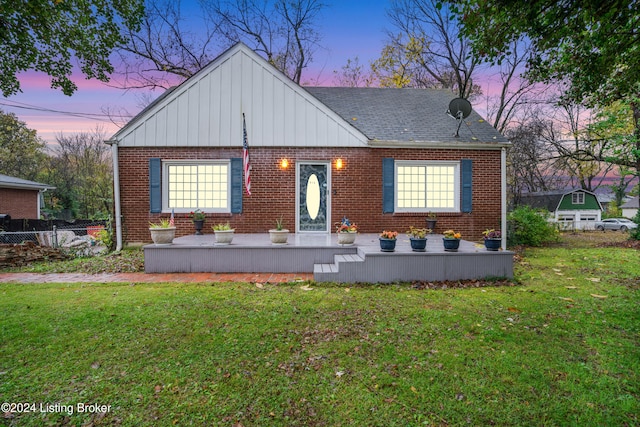 view of front of house with a lawn