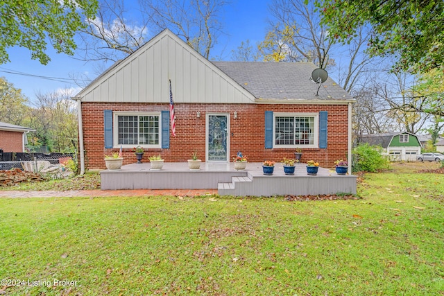 rear view of house with a yard