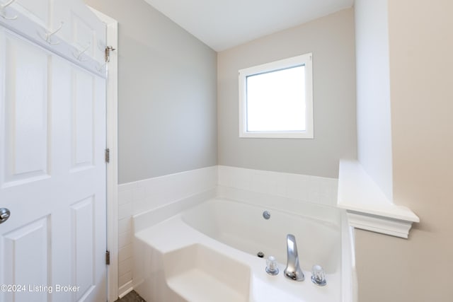 bathroom with a tub