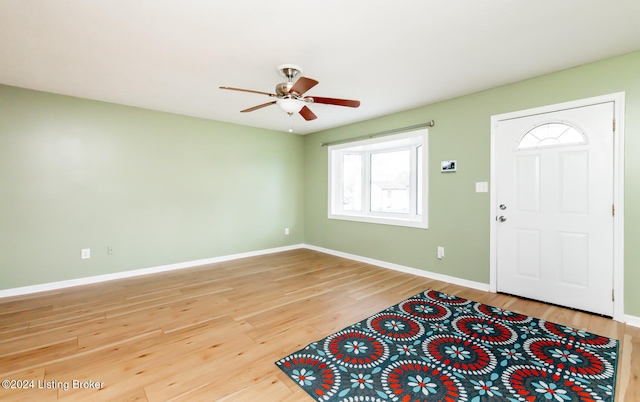 foyer with hardwood / wood-style floors and ceiling fan