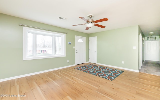 foyer entrance featuring hardwood / wood-style floors and ceiling fan