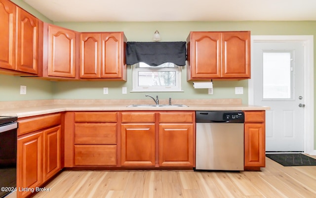 kitchen featuring light hardwood / wood-style floors, sink, and appliances with stainless steel finishes