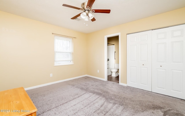 unfurnished bedroom with carpet flooring, ceiling fan, connected bathroom, and a closet