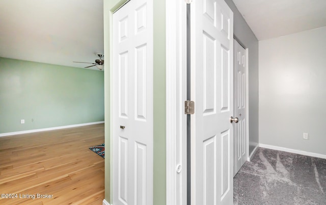 hallway with hardwood / wood-style floors